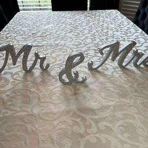 Mr & Mrs AB glitter in silver signs.